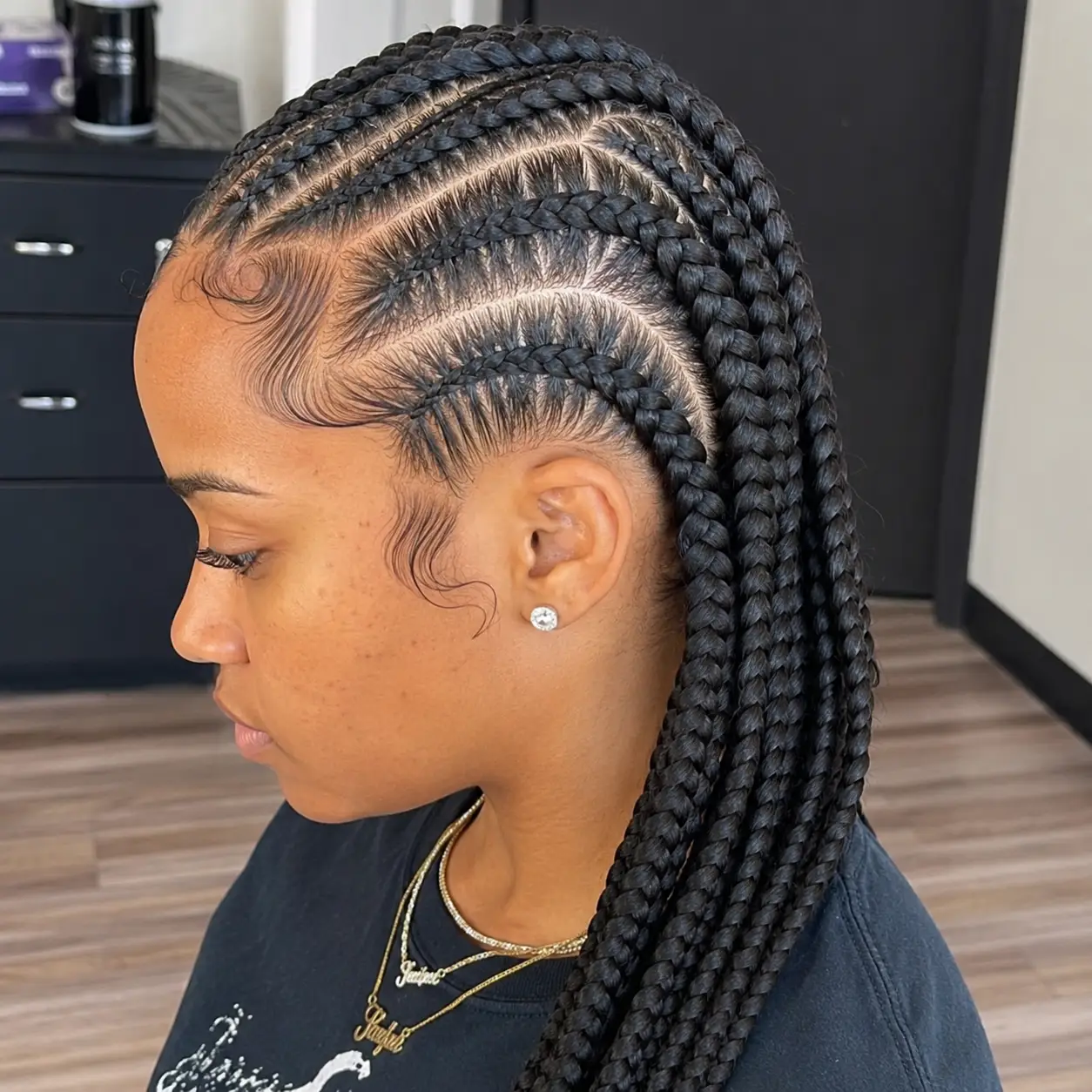 Beautiful white woman with long professional box braids hairstyle in a modern hair salon.